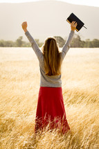 Girl Holding Arms up in Praise