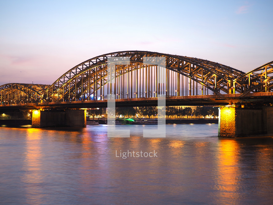 Hohenzollernbruecke (meaning Hohenzollern Bridge) crossing the river Rhein in Koeln, Germany