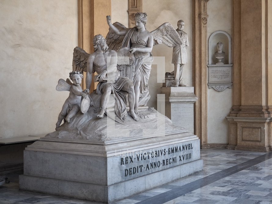 TURIN, ITALY - CIRCA AUGUST 2021: Fama che incatena il Tempo (translation The Fame that chains Time) sculpture by Ignazio and Filippo Collino circa 1788 at Turin University