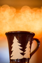 a winter mug in front of bokeh lights 