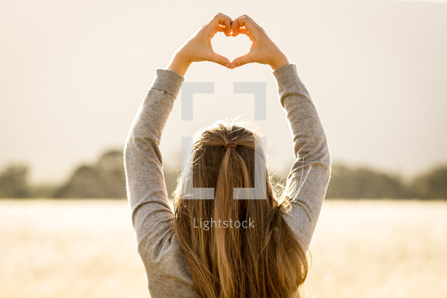 Girl Making Heart with Hands
