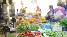 People shopping at a farmer's market.