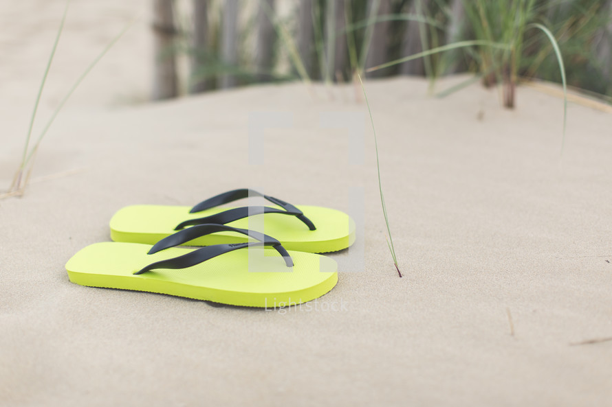 Flip flop shoes on the beach.
