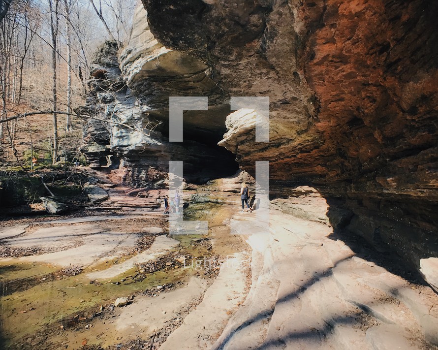 a family exploring a cave 