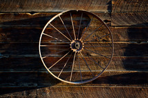 wagon wheel on barn wall