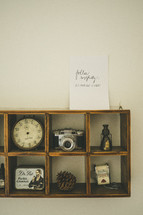 a trinket display box - pinecone, clock, camera, tin, antiques 