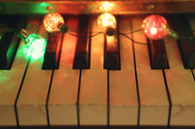 retro coloured lights illuminate a vintage piano