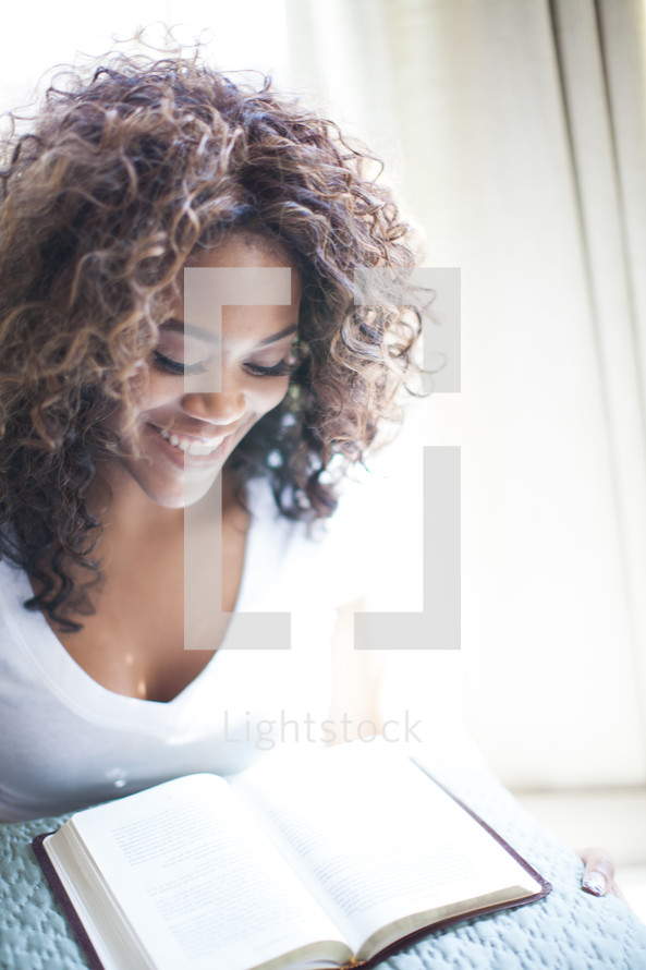 woman reading a Bible