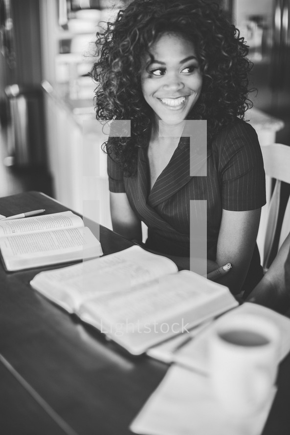 woman at a Bible study smiling