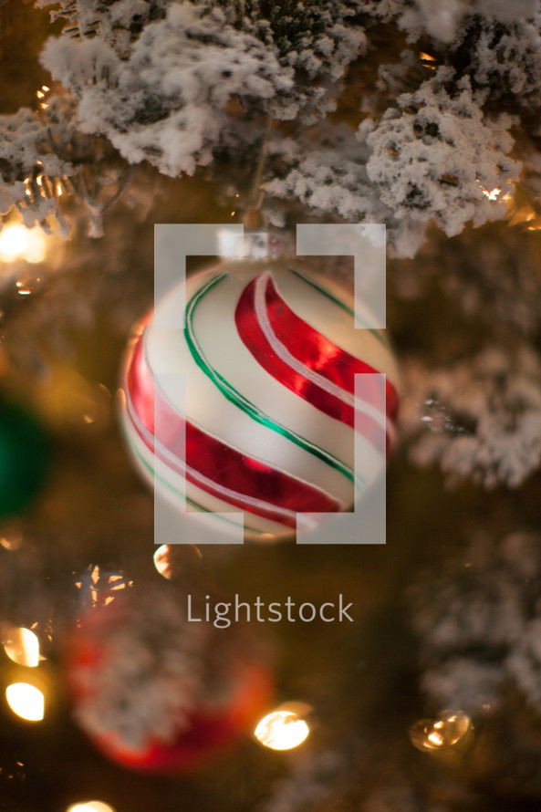 ornaments on a flocked Christmas tree 