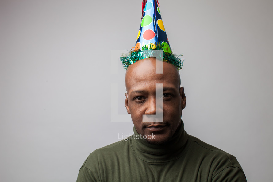 Man wearing a party hat.