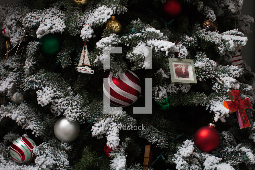 ornaments on a flocked Christmas tree 