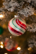 Christmas ornament on a flocked Christmas tree