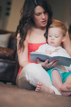 mother and son reading a Bible together