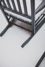 ice and snow on a rocking chair 