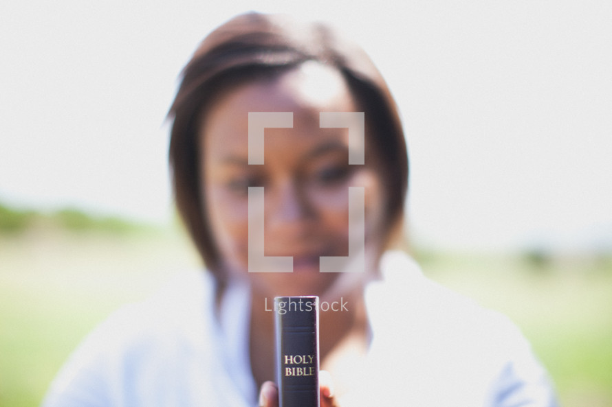 woman holding a Bible 