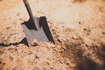 digging a hole with a shovel