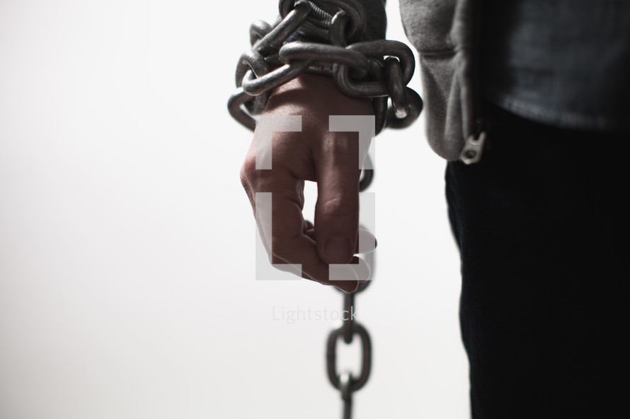 man bound in chains 