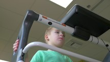 Child undergoing functional electrical stimulation