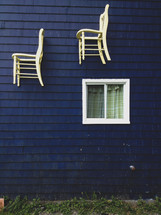 white chairs on a blue house 