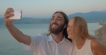 Man and woman posing for selfie 