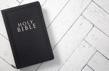 Bible on a white wood background 