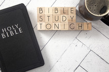 coffee cup and Bible on a white wood background - Bible study tonight 