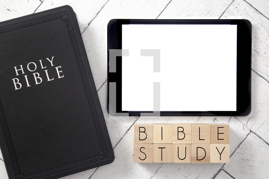 Bible and tablet on a white wood background - Bible study 