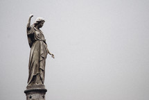 statue pointing up 