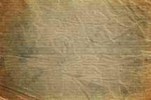 crumpled brown paper textured background.