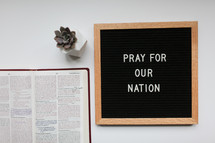 pray for our government sign and open Bible 