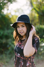 portrait of a teen girl in a hat 