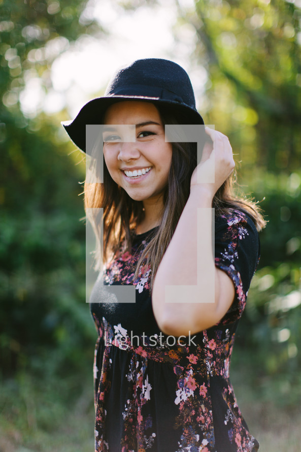 young woman in a hat outdoors 