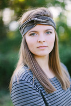 head shot of a teen girl outdoors 