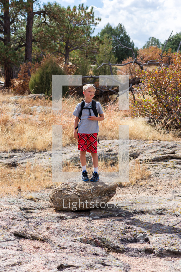 a boy exploring the outdoors 