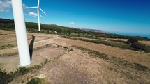 wind power plant generator green energy on the mountains, aerial view fpv