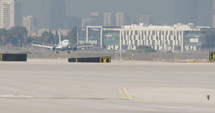 Slow motion shot of passenger airplane taxiing at the airport