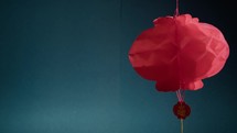 Spinning Chinese Lantern With Copy Space Blue Background