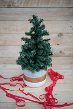 small Christmas tree and red ribbon 