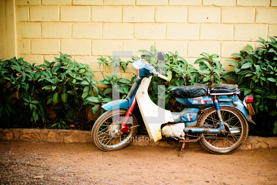 A motorbike on a kickstand