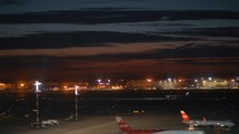 Night view of Sheremetyevo Airport with plane taking off, Moscow