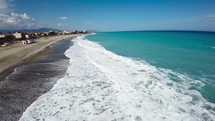 Ocean Waves Crashing into sandy beach 