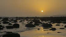 Coast with rocks at sunset
