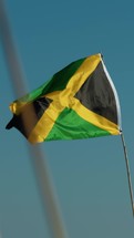 Jamaica Flag Waving With Blue Sky Background