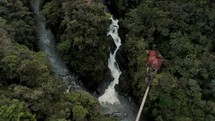 Overhead View Of Rocky River And Pailon del Diablo Waterfall In Baños de Agua Santa, Ecuador. - aerial approach
