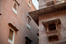 pigeons on the side of a building in Bikaner, India 