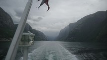 riding a ship through the lysefjord in norway