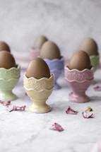 Eggs in colorful egg holders