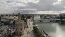 Tower of Gold or Torre del Oro and Guadalquivir river, Seville in Spain. Aerial forward