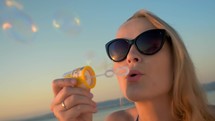 Having fun on vacation with blowing bubbles